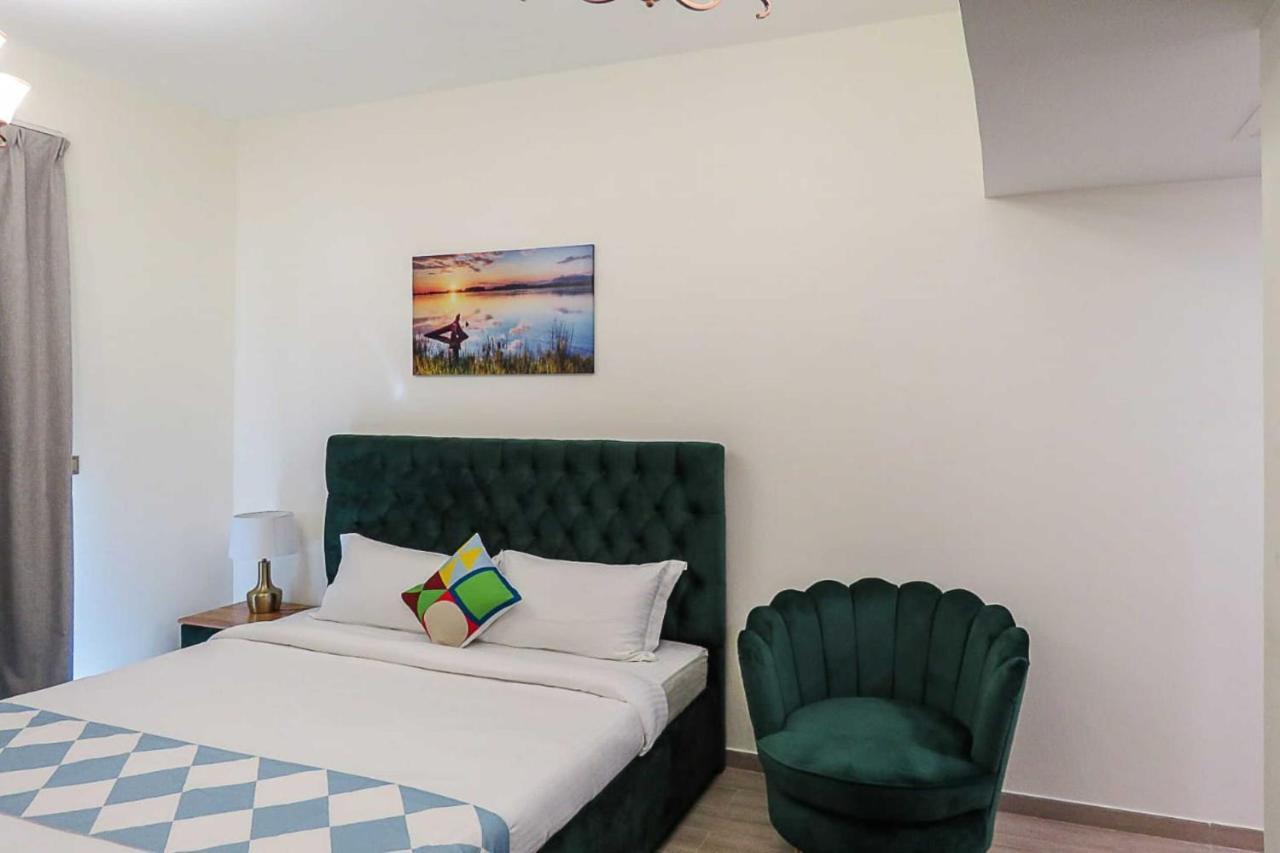 Oyo 860 Studio Apartment, Maya Tower 4, Jumeirah Village Triangle Dubai Exterior photo